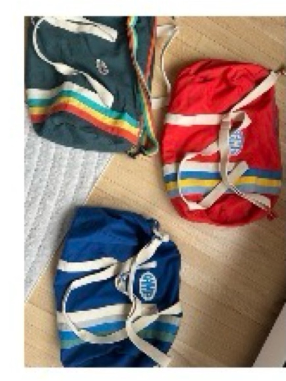 Three Color-Block Duffel Bags - Blue, Red, Teal with Rainbow Stripes